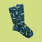 Photograph of navy blue socks covered in light blue and green illustrations of Lacrymaria